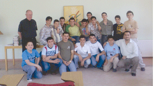 Al Hicks, SJ with students in Amman